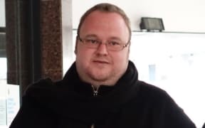 Kim Dotcom leaving court.