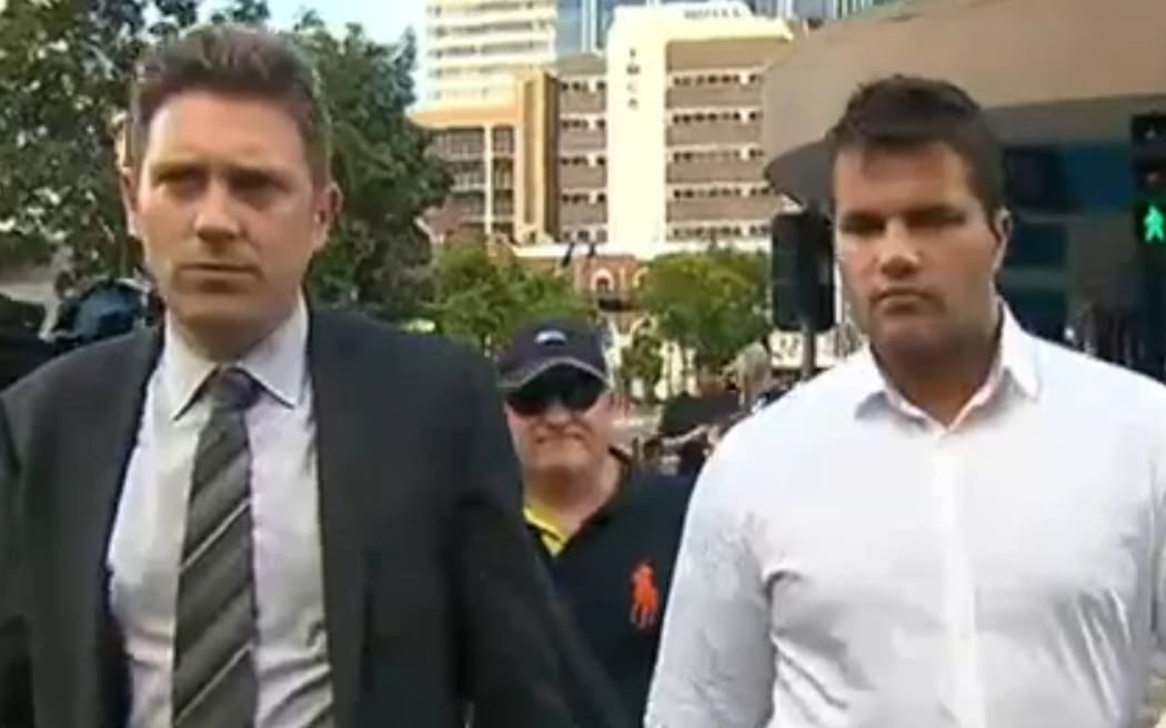 Gable Tostee and one of his lawyers leaves the courthouse after being found not guilty of murder and manslaughter.