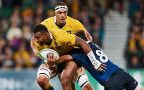 Wallabies centre Samu Kerevi is tackled by Los Pumas loose forward Facundo Isa.