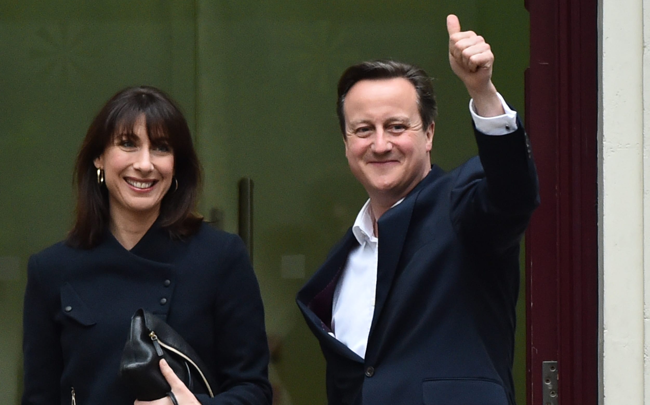 British Prime Minister and Leader of the Conservative Party David Cameron (R) and his wife Samantha.
