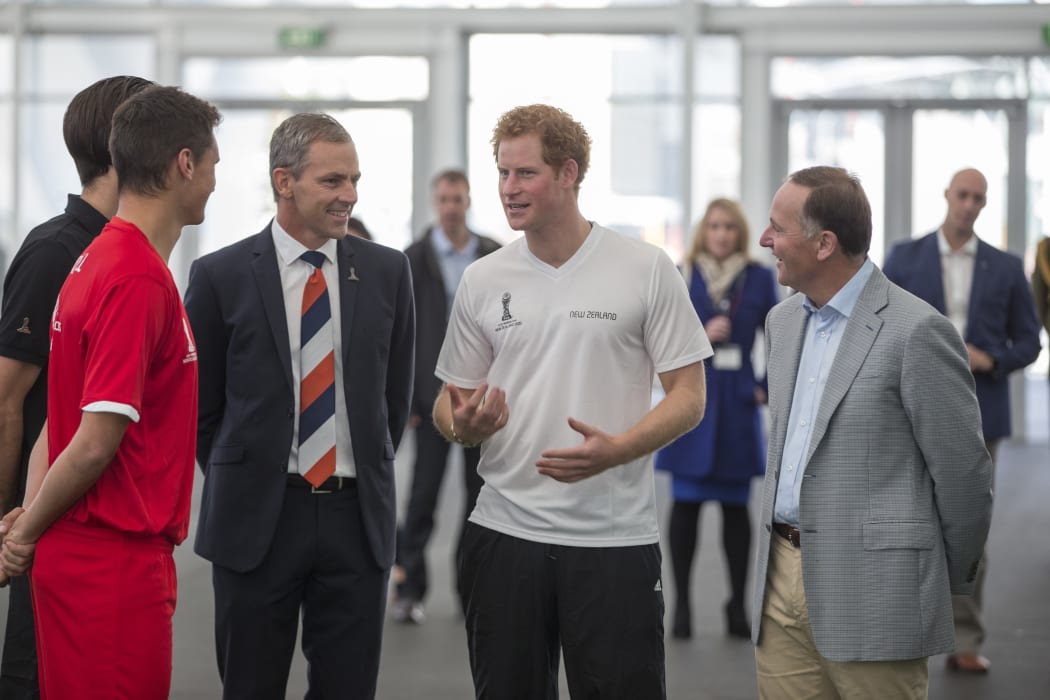 Prince Harry (centre, in white) with Prime Minister John Key (right) at The Cloud.