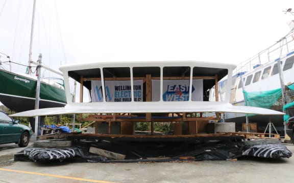 A large structure with windows resting on blocks.