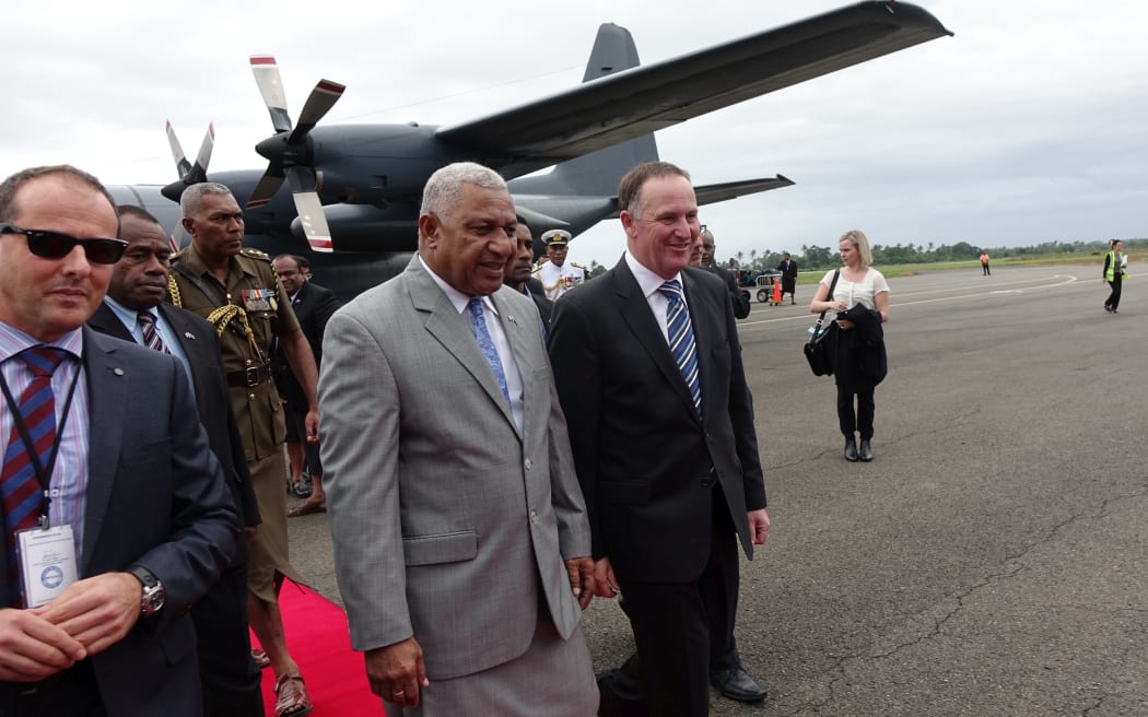New Zealand Prime Minister John Key and Fiji Prime Minister Frank Bainimarama meet at Suva Airport.