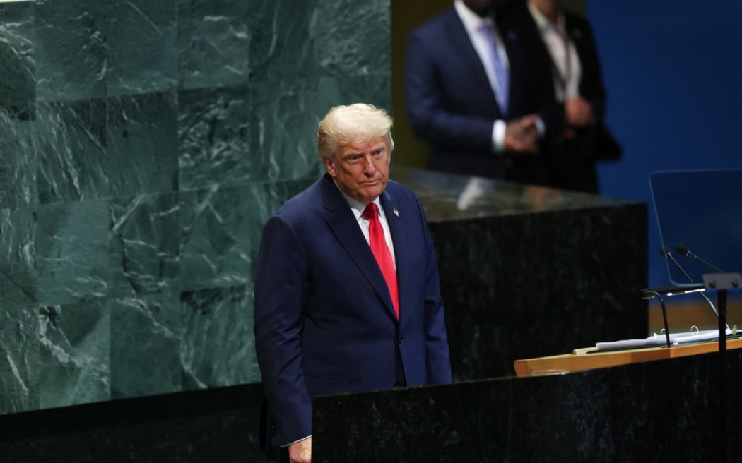 US President Donald Trump stands after concluding his remarks to the United Nations General Assembly at the UN headquarters in New York City on September 23, 2025.