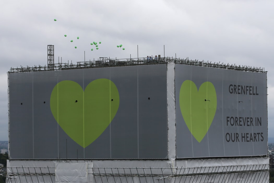 Balloons are released from the top of Grenfell Tower on the anniversary of the Grenfell fire in west London on June 14.