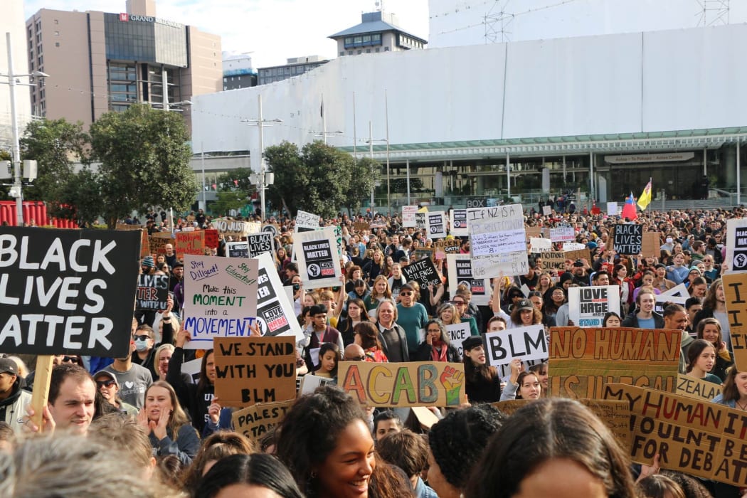Protesters hold up their signs in Aotea Square, Auckland at the Black Lives Matter rally on 14 June, 2020.
