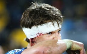 A dejected and bloodied Beauden Barrett.
