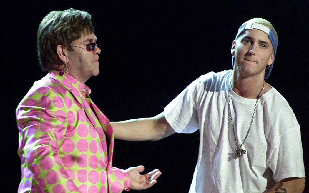 Elton John joins rap musician Eminem during the 2001 Grammy Awards in Los Angele, in February 2001. The controversial, angry rapper won three Grammys despite anger over his lyrics, which critics revile as misogynist, anti-gay and violent.