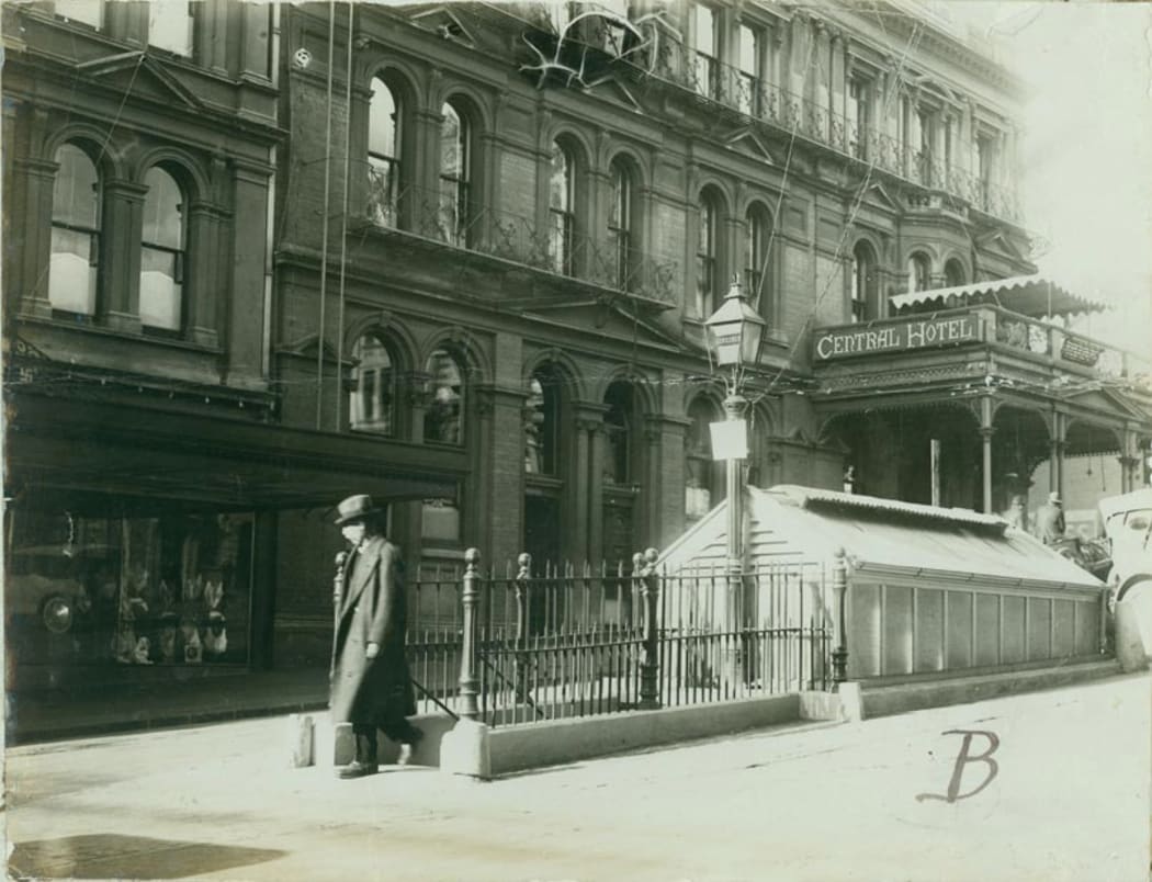 Victoria Street East – A man steps out of an underground public convenience on Auckland’s Victoria Street East circa 1920.