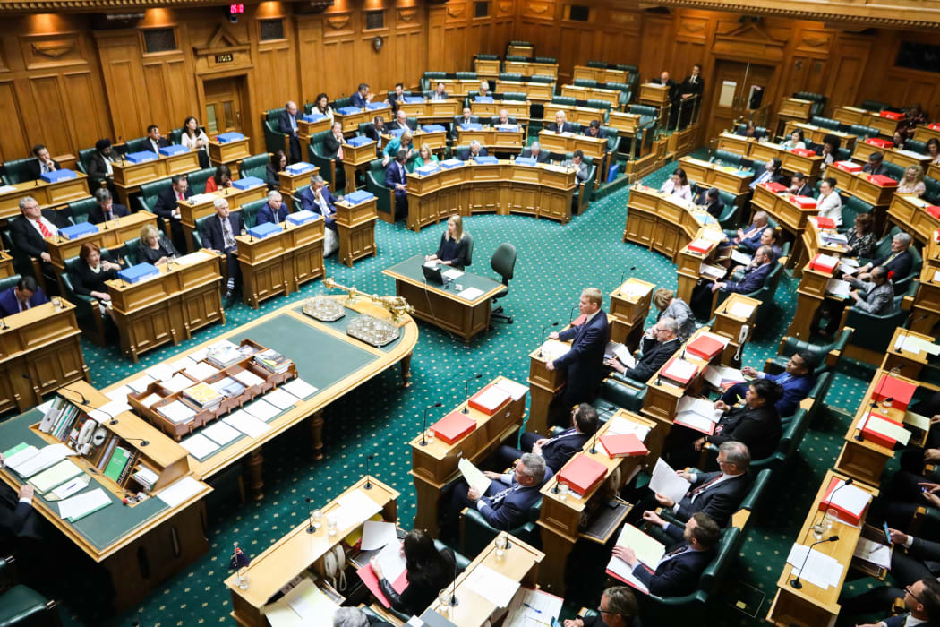 Leader of the House Chris Hipkins answers a question in the debating chamber.