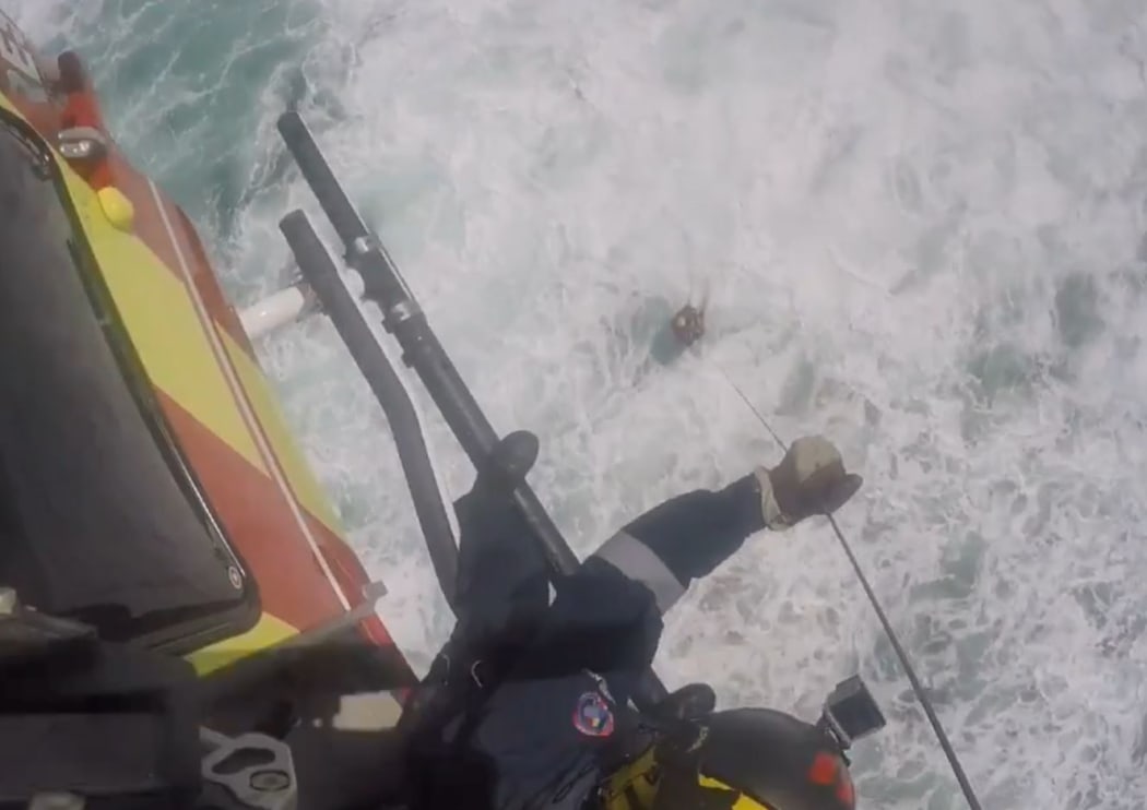 A man was winched to safety by a rescue helicopter after being stranded for two hours.