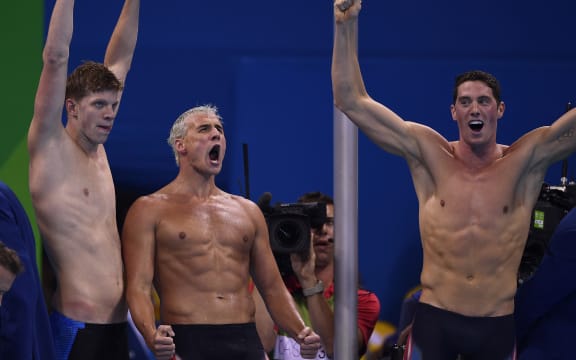 US swimmers Townley Haas, Ryan Lochte and Conor Dwyer celebrate after winning the Men's 4x200m Freestyle Relay Final at the Rio 2016 Olympic Games.