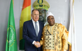 This handout picture taken and released by the Russian Foreign Ministry on June 3, 2024 shows Russian Foreign Minister Sergey Lavrov (L) shaking hand with his Guinean counterpart Morissanda Kouyate (R) during their meeting in Conakry as part of lavrov's first leg of an African tour aimed at buttressing Moscow's influence in the world's poorest continent. (Photo by Handout / RUSSIAN FOREIGN MINISTRY / HANDOUT / AFP) / RESTRICTED TO EDITORIAL USE - MANDATORY CREDIT "AFP PHOTO  / Russian Foreign Ministry " - NO MARKETING NO ADVERTISING CAMPAIGNS - DISTRIBUTED AS A SERVICE TO CLIENTS