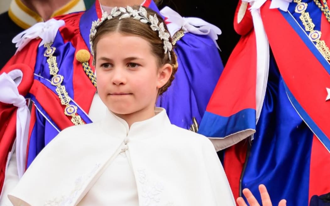 Princess Charlotte waves from the Buckingham Palace balcony.