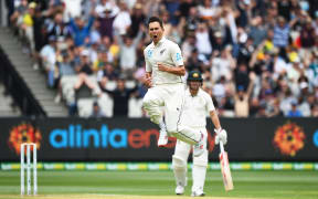 Trent Boult celebrates the wicket of Joe Burns.
