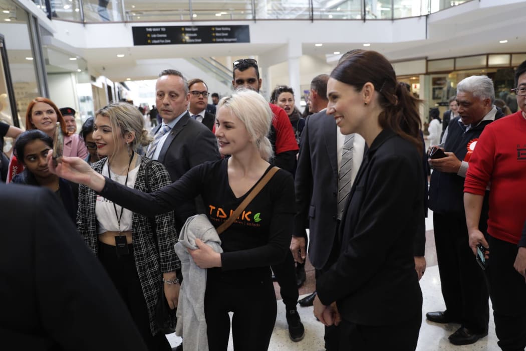Labour Party leader Jacinda Ardern taking a selfie with a member of the public while campaigning in Hamilton on 23 September, 2020.