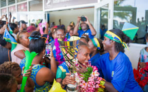 The Solomon Islands Football Federation's national women's team in Honiara on Monday, 21 July. Thousands of supporters greeted captain Ileen Pegi, coach Moses Toata and the players to show their appreciation for winning the OFC Women's Nations Cup title in Fiji.