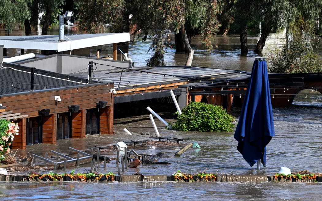 A pub is inundated by water during flooding in the Melbourne suburb of Maribyrnong on October 14, 2022. (Photo by William WEST / AFP)
