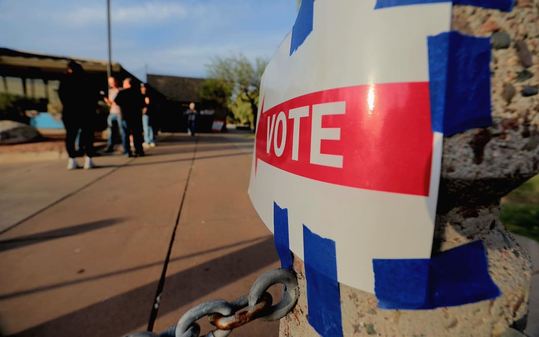 Voters queue at a voting center at Indian Bend Wash in Arizona