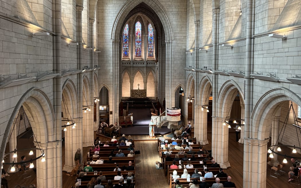 Picture of a church interior and the attendees.