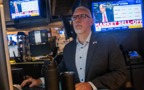 Traders work on the floor of the New York Stock Exchange (NYSE) on 5 August 2024, in New York City as US stocks plunge.