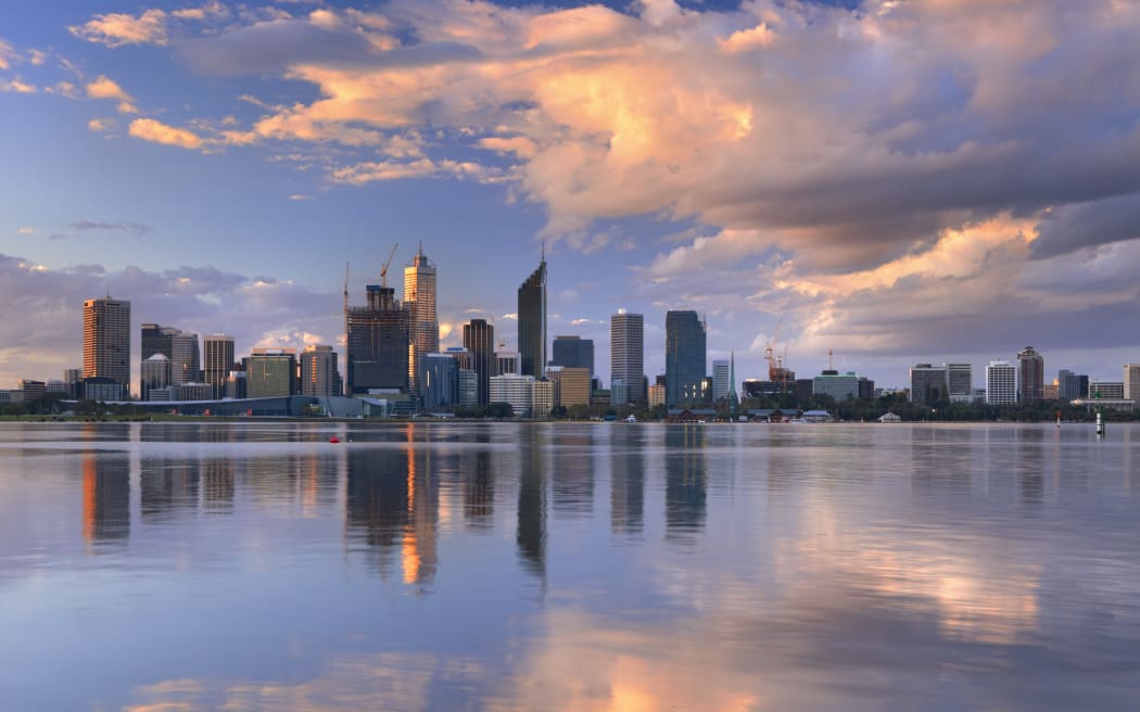 The skyline of Perth, Western Australia at sunset. Photographed from across the Swan River.