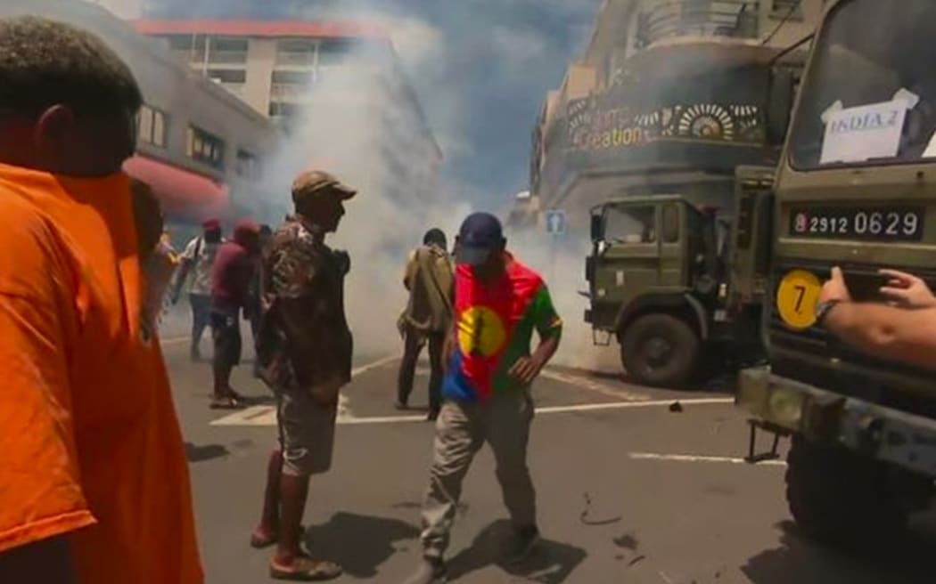 Teargas during clashes between French police and Union Calédonienne militants in central Nouméa 21 February 2024.
