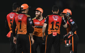 Sunrisers Hyderabad cricket captain Kane Williamson (C) celebrates with teammates during a 2019 Indian Premier League (IPL) Twenty20 match.
