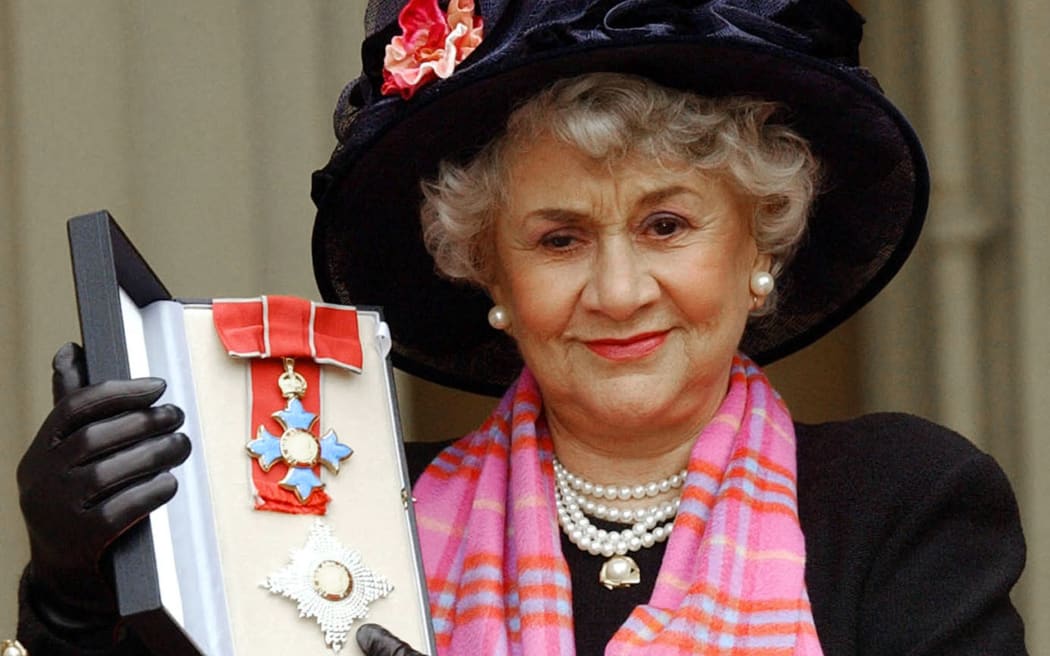 (FILES) Actress Joan Plowright poses for pictires after being made a Dame by the Prince Of Wales at Buckingham Palace in London, 20 February, 2004. Oscar-nominated UK actress Joan Plowright, a legend of stage and screen and wife of the great actor Laurence Olivier, has died at the age of 95, her family said Friday, January 17. (Photo by STEFAN ROUSSEAU / POOL / AFP)