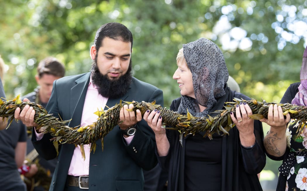 Shagaf Khan and Christchurch Mayor Lianne Dalziel during the handover of a lei at the Al Noor Mosque