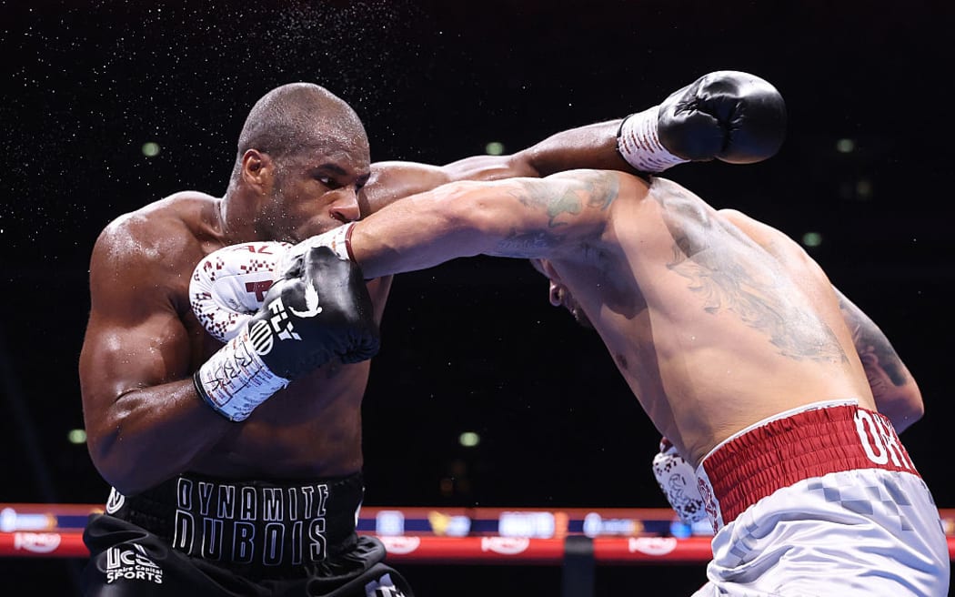 Daniel Dubois and Oleksandr Usyk exchange punches during their IBF, IBO, WBC and WBO World Heavyweight titles' fight.