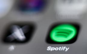 X and Spotify icons are seen displayed on a phone screen in this illustration photo taken in Krakow, Poland on January 4, 2025. (Photo by Jakub Porzycki/NurPhoto) (Photo by Jakub Porzycki / NurPhoto via AFP)