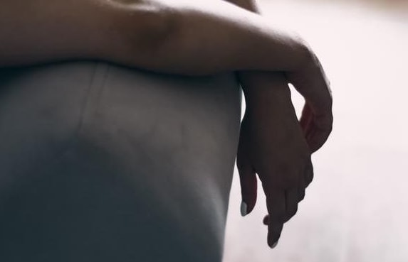 tired woman's arms