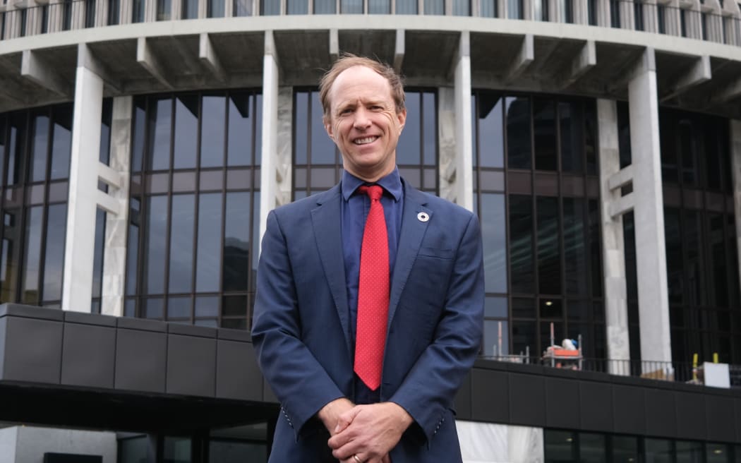 Green Building Council chief executive Andrew Eagles standing in front of the Beehive in Wellington