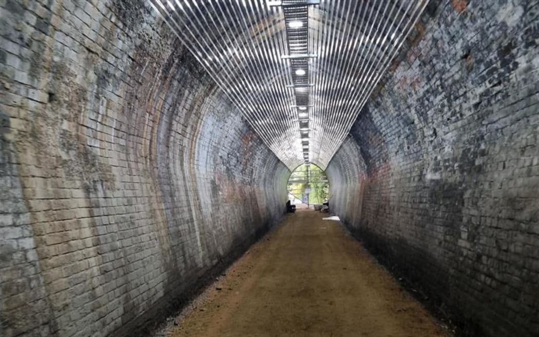 A 1.55 kilometre section from Wingatui through the Chain Hills Tunnel is close to opening. 
The Chain Hills Tunnel opened in the 1870s as a single railway line before being decommissioned more than three decades later.