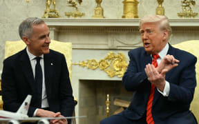 US President Donald Trump meets with Canadian Prime Minister Mark Carney in the Oval Office of the White House in Washington, DC, on May 6, 2025. (Photo by Jim WATSON / AFP)
