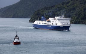 Bluebridge ferry the Connemara berthing at Picton wharf, helped by a tug, after earlier hitting the wharf while attempting to berth.