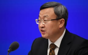 Vice Minister of Commerce and Deputy International Trade Representative Wang Shouwen speaks during the State Council Information Office press conference in Beijing on December 13, after US President Donald Trump confirmed he was canceling new tariffs on China as part of a "phase one" trade deal.