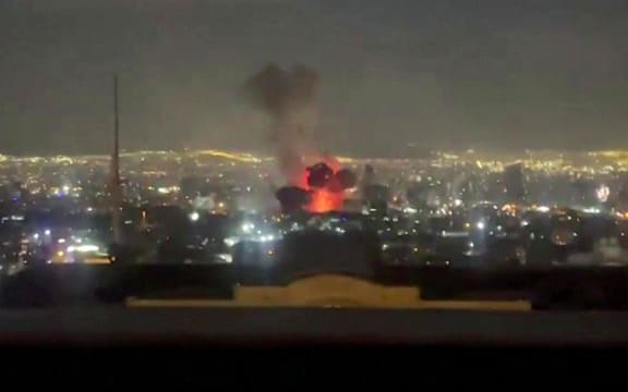 This video grab taken from UGC images posted on social media on March 1, 2026 shows an explosion following a strike on Tehran that appears to have occurred near state television channel IRIB. The United States and Israel launched strikes against Iran on February 28, with Israel's public broadcaster reporting that the Iranian supreme leader had been targeted, as the Islamic republic retaliated with barrages of missiles at Gulf states and Israel. (Photo by UGC / AFP) / NO USE AFTER MARCH 16, 2026 20:56:18 GMT - RESTRICTED TO EDITORIAL USE - MANDATORY CREDIT AFP -  SOURCE: UGC / UNKNOWN - DISTRIBUTED AS A SERVICE TO CLIENTS - NO RESALE -