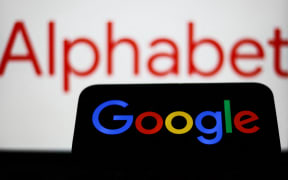 Alphabet logo displayed on a laptop screen and Google logo displayed on a phone screen are seen in this illustration photo taken in Krakow, Poland on September 9, 2024. (Photo by Jakub Porzycki/NurPhoto) (Photo by Jakub Porzycki / NurPhoto / NurPhoto via AFP)