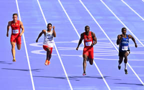 A men's 100m heat at the Paris Olympics.