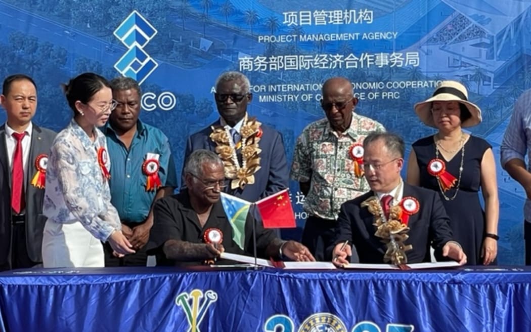 Solomon Islands Prime Minister Manasseh Sogavare (back centre) at the handover ceremony with Chinese Ambassador to Solomon Islands Li Ming