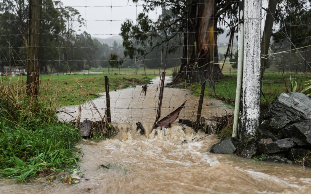 Foxhill resident Graeme Burbidge is diverting water to protect his property.