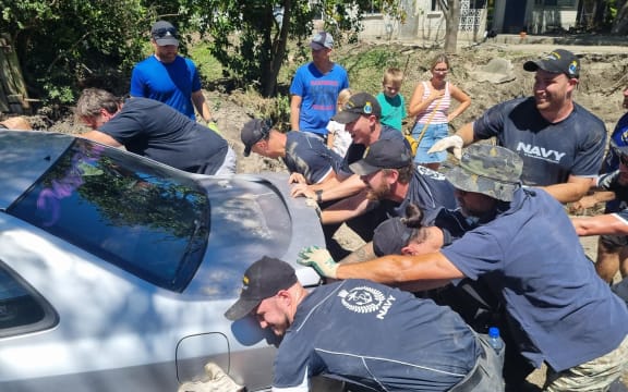 Houses on Joll Road in Havelock North were inundated with contaminated mud during Cyclone Gabrielle, but the community and Navy pitched in to help clean up the street and homes.