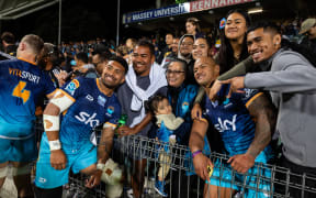 Moana Pasifika captain Ardie Savea and Laomilo Laomilo celebrate with fans after their win in the Super Rugby Paciﬁc - Moana Pasiﬁka v Hurricanes at North Harbour Stadium.
