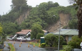 One of the Maungatapu homes was shunted into the street by the landslide in January last year. Photo: John Borren/SunLive.