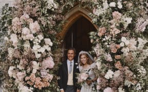 Britain's Princess Beatrice of York and her husband Edoardo Mapelli Mozzi leave The Royal Chapel of All Saints at Royal Lodge, Windsor, west of London, on July 17, 2020 after their marriage ceremony.