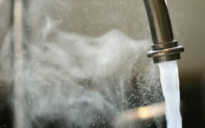 Water tap running.