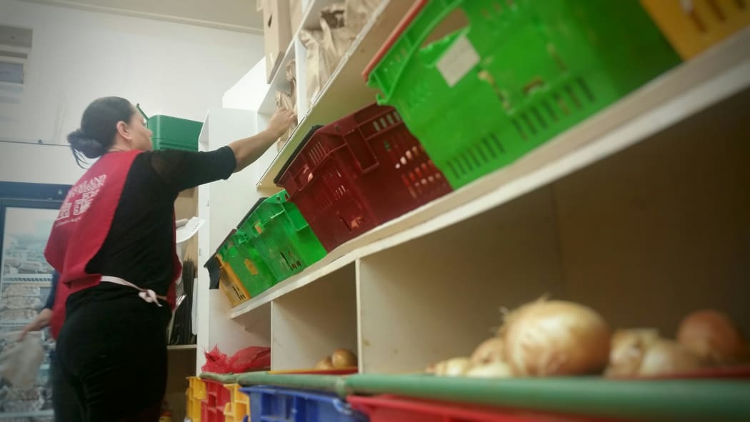 Volunteers sort food at the City Mission