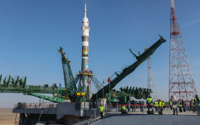 In this handout picture taken and released by Russia's Roscosmos space agency on March 18, 2024, The Soyuz MS-25 spacecraft is seen mounted on the launch pad at the Russian-leased Baikonur cosmodrome in Kazakhstan. The International Space Station (ISS) expedition 71 crew of NASA astronaut Tracy Dyson, Roscosmos cosmonaut Oleg Novitskiy and Belavia flight attendant and spaceflight participant Marina Vasilevskaya of Belarus, will blast off to the ISS aboard the Soyuz MS-25 spacecraft March 21, 2024. (Photo by Handout / ROSCOSMOS / AFP) / RESTRICTED TO EDITORIAL USE - MANDATORY CREDIT "AFP PHOTO / Roscosmos" - NO MARKETING NO ADVERTISING CAMPAIGNS - DISTRIBUTED AS A SERVICE TO CLIENTS
